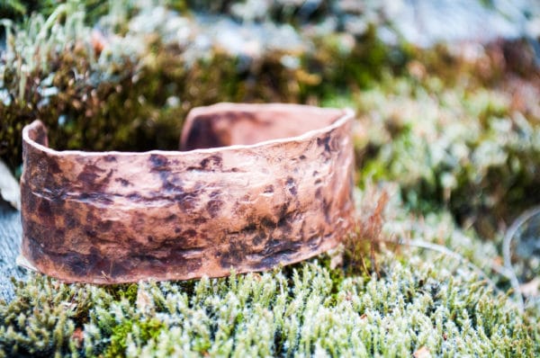 Copper Bracelet on moss by Palmer Folk School.