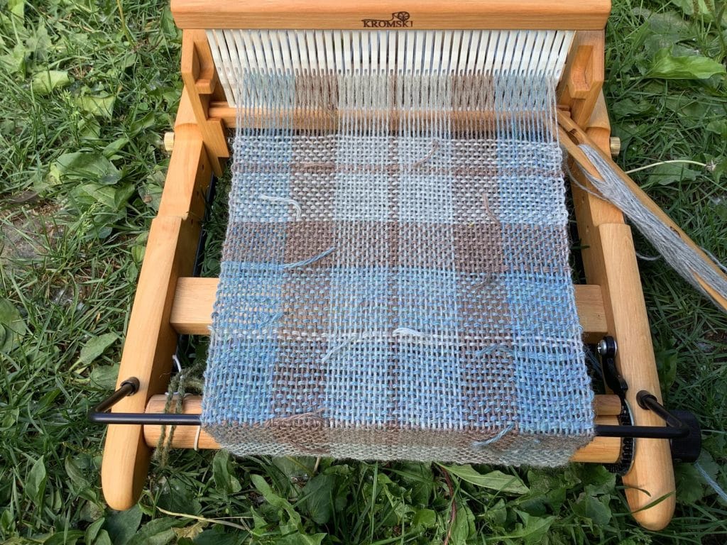 Weaving on a loom.
